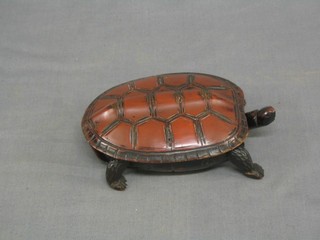 A 19th Century Oriental carved red lacquered trinket box in the form of a turtle 6"