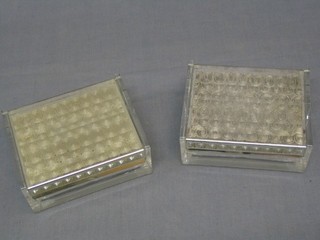 A pair of Art Deco chromium plated and perspex rectangular WMF cigarette boxes with hinged lids 5"