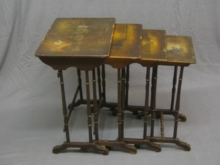 A quartetto of 19th Century lacquered interfitting coffee tables, the tops painted romantic scenes 21"