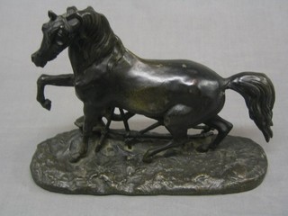 A spelter figure of a standing horse, raised on an oval naturalistic base (tail f and r) 9"
