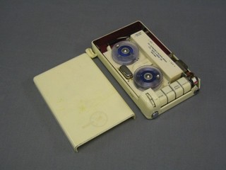 An early portable reel to reel tape recorder by Minifon P55 contained in a white Bakelite case