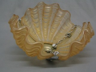An Art Deco amber glass and chromium plated scallop shaped light fitting