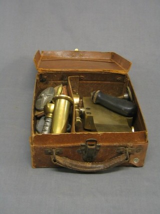 A brass instrument marked Bulcanizer, cased