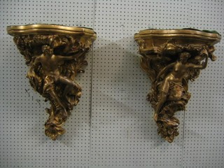 A pair of impressive gilt plaster wall brackets in the form of semi-naked ladies 24" (1 with arm f)