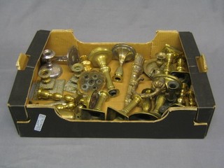 A box of various old brass candlesticks