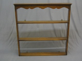 An 18th Century style oak and mahogany 3 tier hanging plate rack with moulded cornice 41"