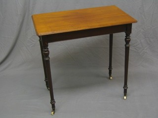 A Victorian rectangular mahogany occasional table, raised on turned and fluted supports 30"