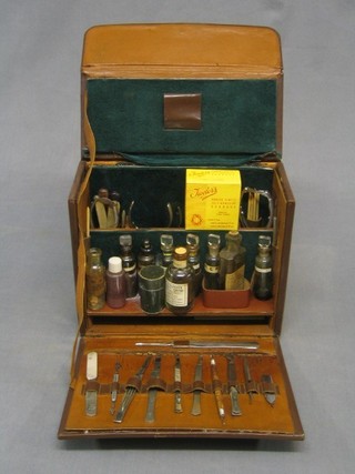 A Chiropodist's travelling kit comprising various scalpels etc contained in a leather carrying case