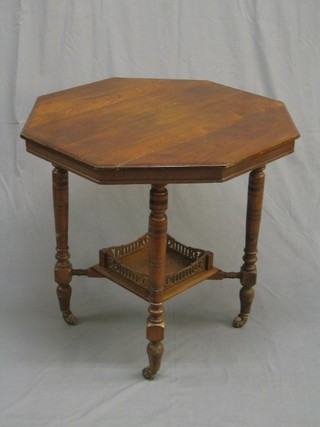 A Victorian oak octagonal shaped occasional table, raised on turned supports united by a square undertier, 30", top with 2 slight splits