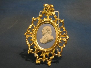 An oval blue Wedgwood Jasperware plaque decorated a portrait of William Shakespeare 4" contained in a decorative gilt frame