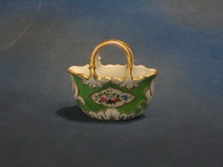 A 19th Century Continental porcelain vase in the form of a basket with green panel and floral decoration 5" (f and r)