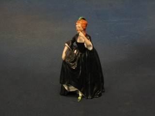 A Goebal? porcelain figure of a standing lady in a black ball gown 6"