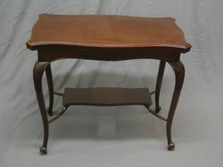A Victorian shaped mahogany card table raised on cabriole supports united by an undertier 33"