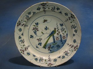 An 18th/19th Century Delft plate decorated a seated bird 13" (f and r with some chips to the rim)