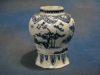 A "Delft" vase of club form decorated Oriental figures amidst landscape 9", some chips to rim 