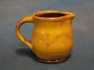 An Art Pottery jug, the handle with signature mark, brown glazed 4"