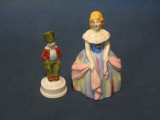 A pottery figure of a Crinoline lady 5" and 1 other of a small Russian boy 3"