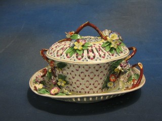 A fine quality 18th Century porcelain twin handled basket shaped bowl with pierced porcelain lid and floral encrusted decoration 9", raised on a similar stand 10" (stand with large crack and handle f)