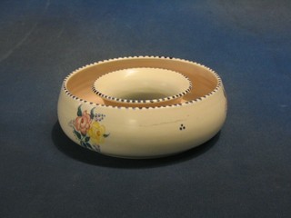 A circular Poole Pottery flower ring 7"