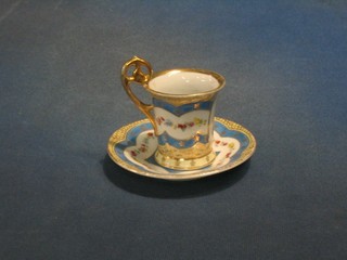 A 19th/20th Century Continental cabinet cup and saucer decorated a noble lady, the base marked BAXE