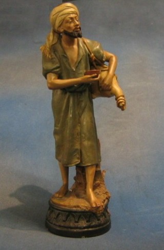 A 19th Century terracotta figure of a standing Arab man with sack and cup, 16", the base impressed 6019 62