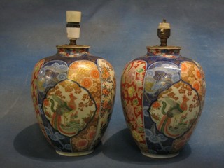 A pair of 19th Century Japanese Imari porcelain vases of globular form, drilled and converted to electric table lamps 12"