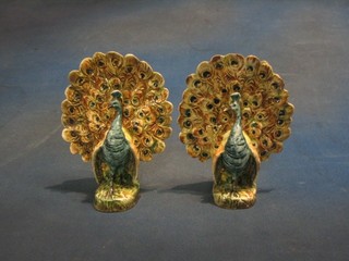 A pair of pottery spill vases in the form of standing peacocks 7"