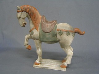 A reproduction plaster figure of a Tang horse