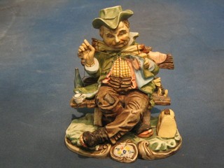 A Capo di Monte Mount Cristo biscuit porcelain figure of a seated tramp, 8"