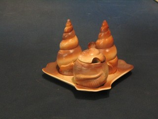 A Carltonware 3 piece condiment set in the form of shells, raised on a tray