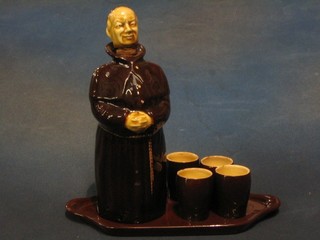 A Kirkham pottery 7 piece pottery spirit set  with decanter in the form of a monk, twin handled tray and 6 spirit tots (some chips)