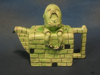 A green glazed Sadler teapot decorated Humpty Dumpty, the base marked RD830.104