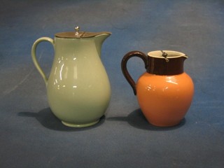 A Wedgwood green glazed jug with metal top 7" together with a Malkin jug 5 1/2"