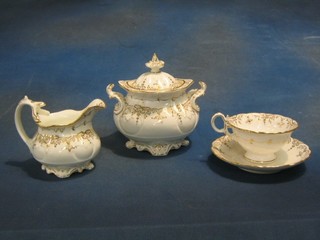 A Rockingham style tea service with gilt banding