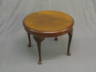 A circular Art Deco mahogany coffee table raised on cabriole supports 24"