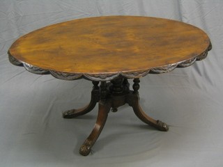 A Victorian circular figured walnut and crossbanded Loo table, raised on 4 turned column supports (chip to one and veneers rising slightly)