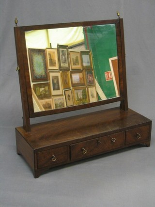 A 19th Century rectangular plate dressing table mirror contained in a mahogany swing frame, the base fitted 1 long and 2 short drawers, raised on bracket feet 23"