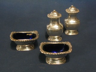 A Georgian style 4 piece silver plated condiment set comprising pair of salts and pair of peppers