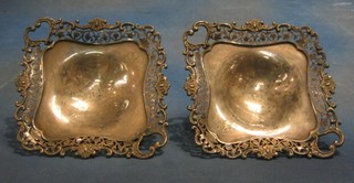 A handsome pair of triangular pierced silver plated bon bon dishes 11"