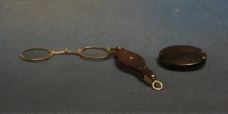 A pair of 19th Century tortoiseshell and steel lorgnettes together with a folding eye glass