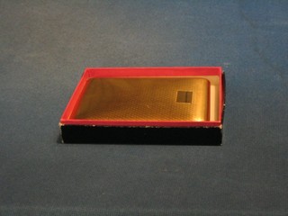 A 1950's Colibri gilt metal cigarette case complete with original cardboard carton