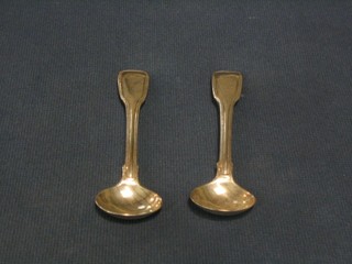 A pair of Victorian silver fiddle and thread pattern mustard spoons London 1848 and 1889