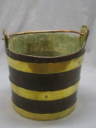 An 18th/19th Century coopered oak bucket with brass banding and heart shaped brass mounts 14"