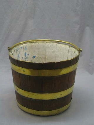 An 18th/19th Century  oak coopered peet bucket with brass banding and brass swing handle