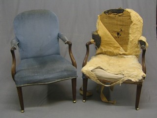 A pair of 19th Century mahogany open arm chairs raised on square tapering supports ending in brass caps and castors, 1 upholstered in blue material (1 requiring upholstery)
