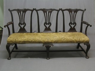 An 18th Century Chippendale style triple chair back settee, raised on carved cabriole supports 69" (made up and old break to back leg)