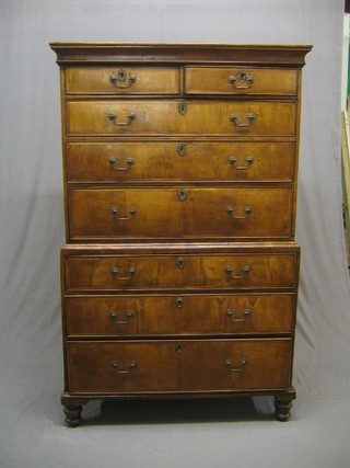 An 18th Century bleached walnut chest on chest with moulded cornice, fitted 2 short and 3 long drawers, the base fitted 3 long drawers, raised on bun feet 42"