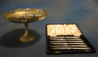 A circular silver plated pierced dish, a bottle stopper and 6 tea knives