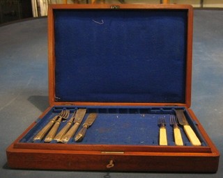 A set of 6 silver plated fish knives and forks and other flatware in an oak canteen box
