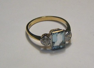 A lady's 18ct gold dress ring set a rectangular cut aquamarine and 2 diamonds